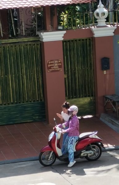Picture: A social worker is teaching a child who will be going out for vocational training to ride a motorcycle.